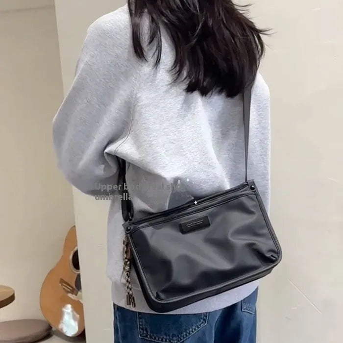 Unisex casual retro crossbody bag in Oxford cloth, small square shape, cool trendy style, single bag without ornaments