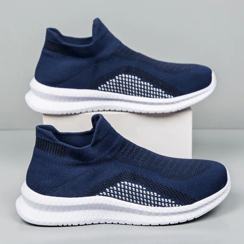 Popcorn Flyknit low-top fabric casual sneakers in black, shown from the side on a white background.