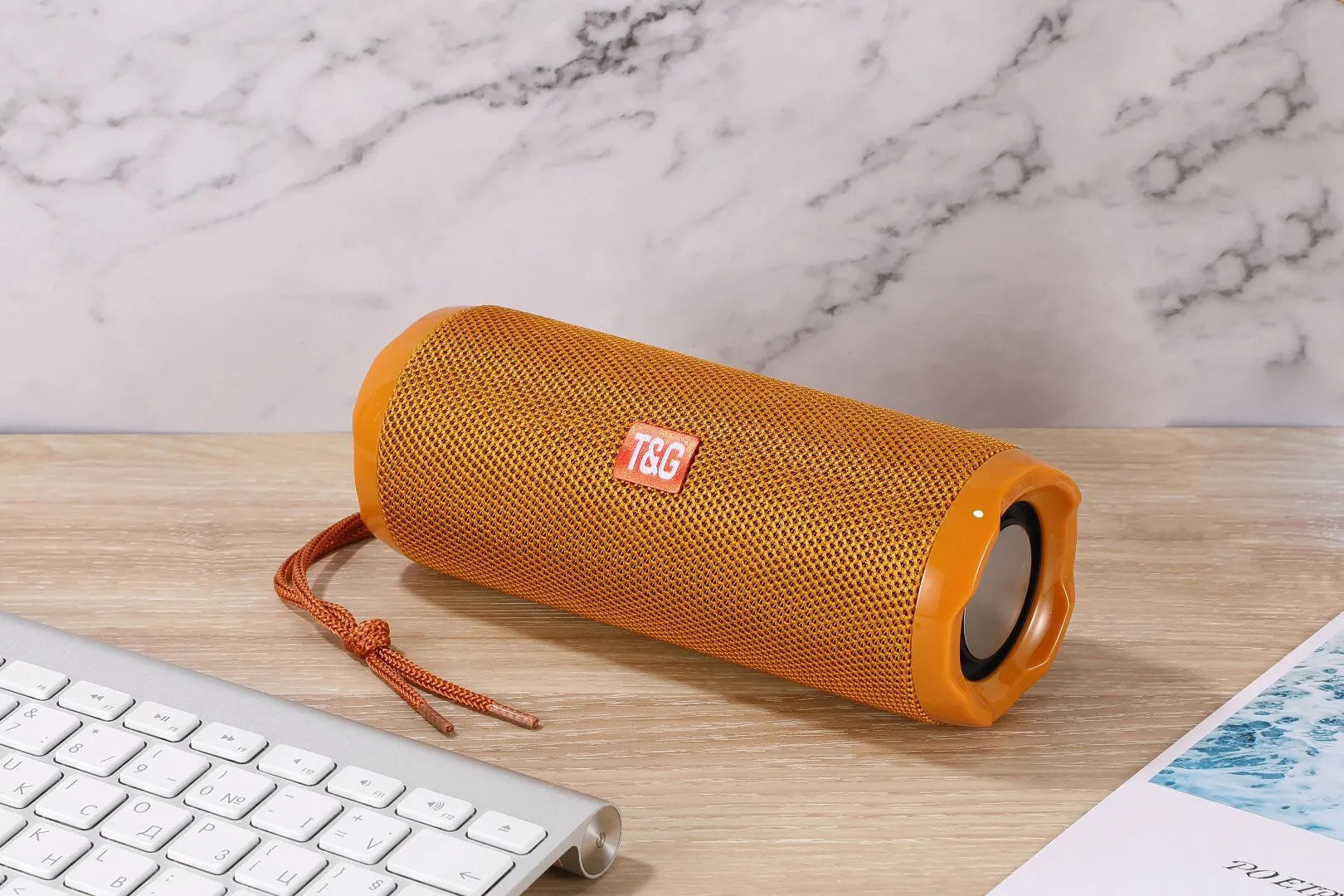 Fabric-covered portable Bluetooth speaker with integrated card holder in multiple colour options
