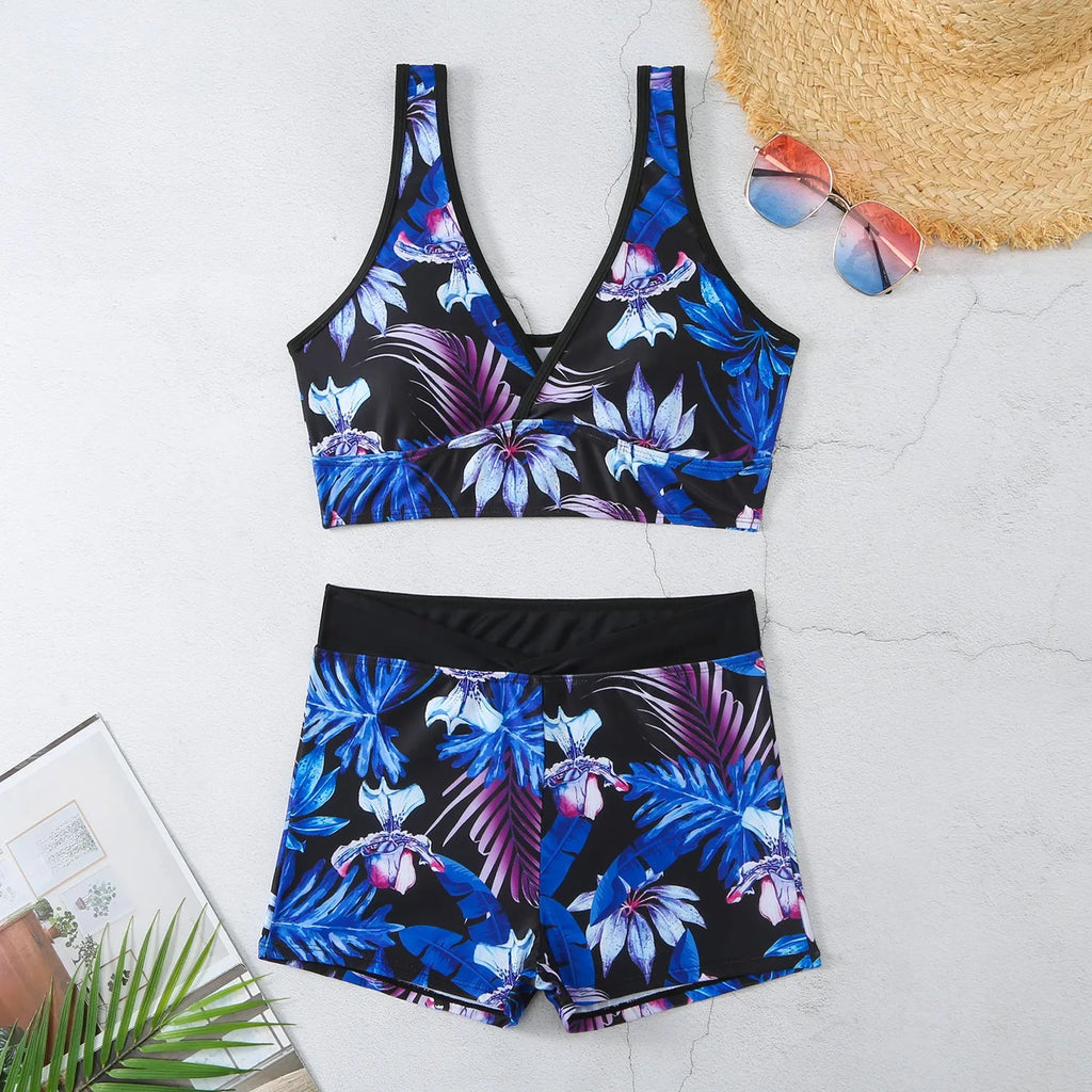 Women's two-piece swimsuit set with printed boxer briefs and sleeveless top in a multi-colour pattern.
