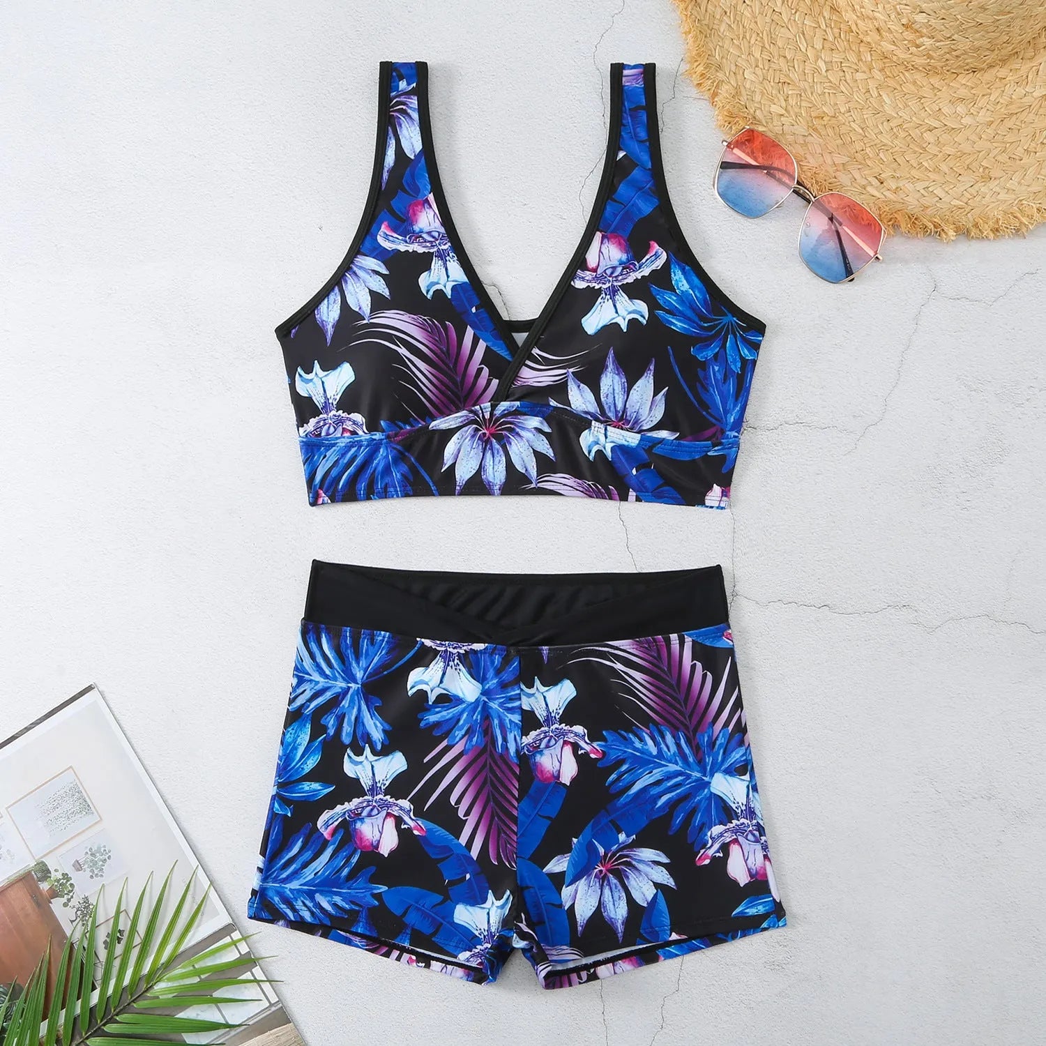 Women's two-piece swimsuit set with printed boxer briefs and sleeveless top in a multi-colour pattern.