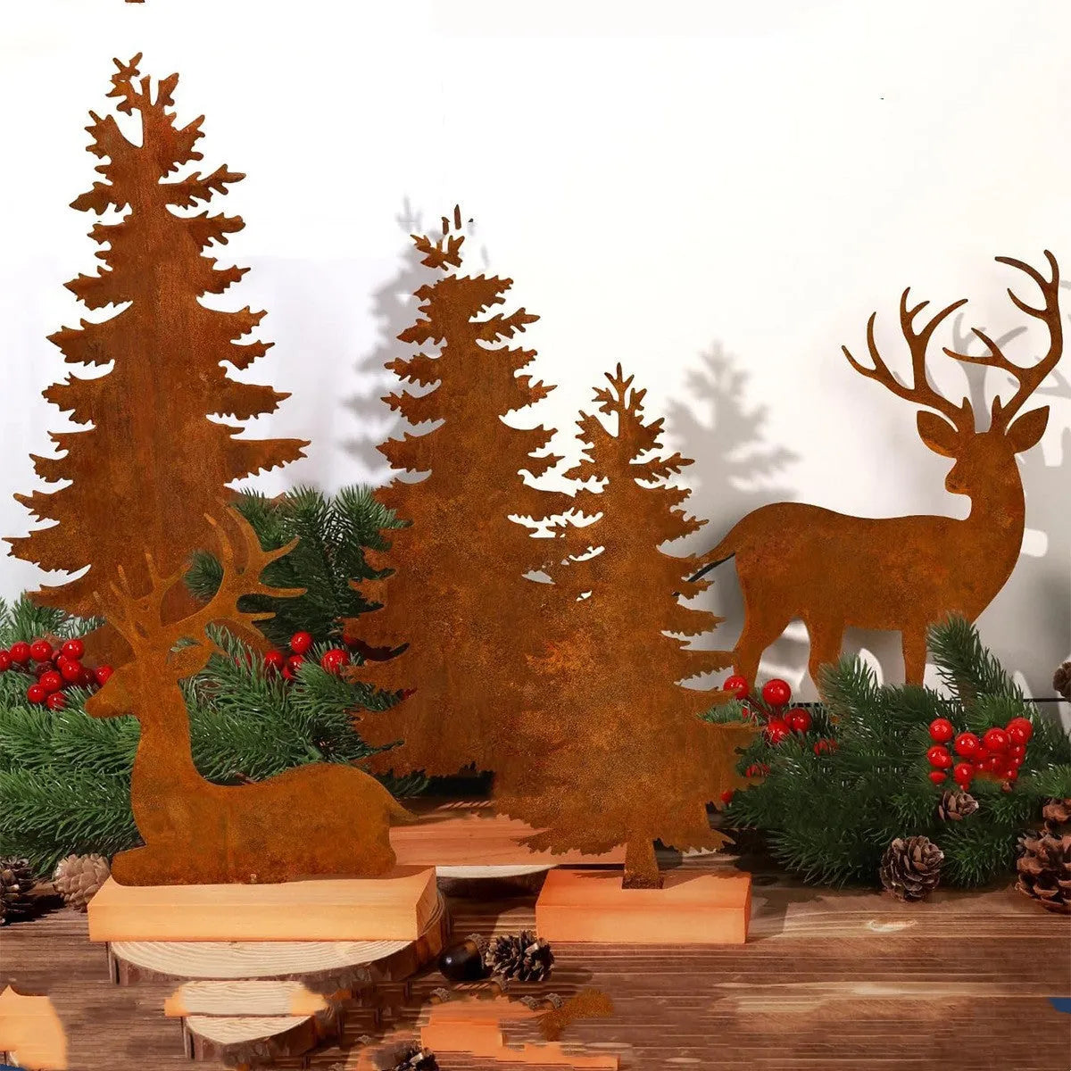 Three metal Christmas tree decorations with elk antlers in rustic finish