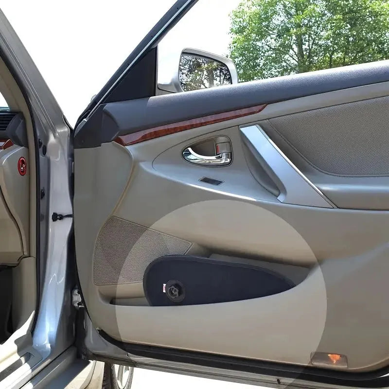 Black adjustable car side window shades with suction cups stretched over car window