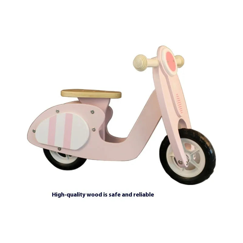 Pink wooden balance scooter with 10-inch wheels for toddlers and young children.
