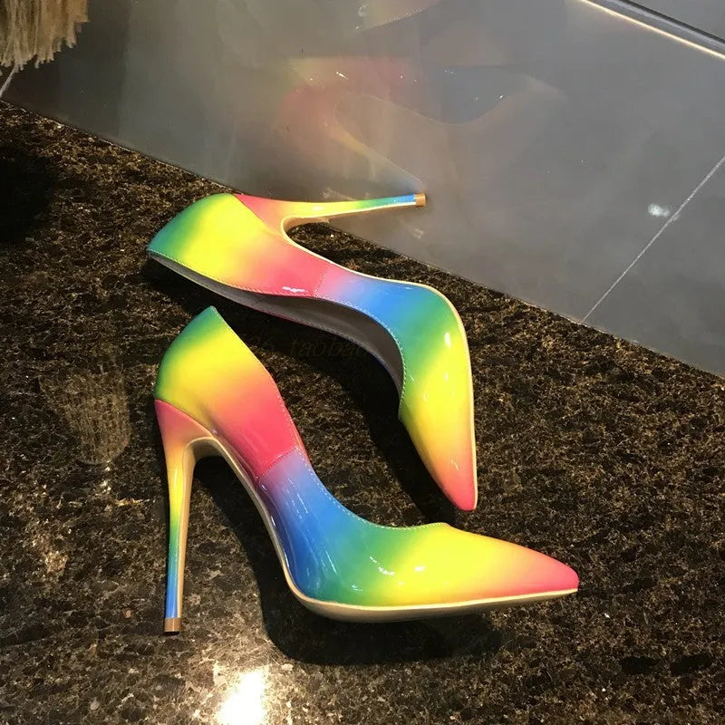 Rainbow patent leather women's ultra-high heel pointed toe stiletto pump shoes on white background