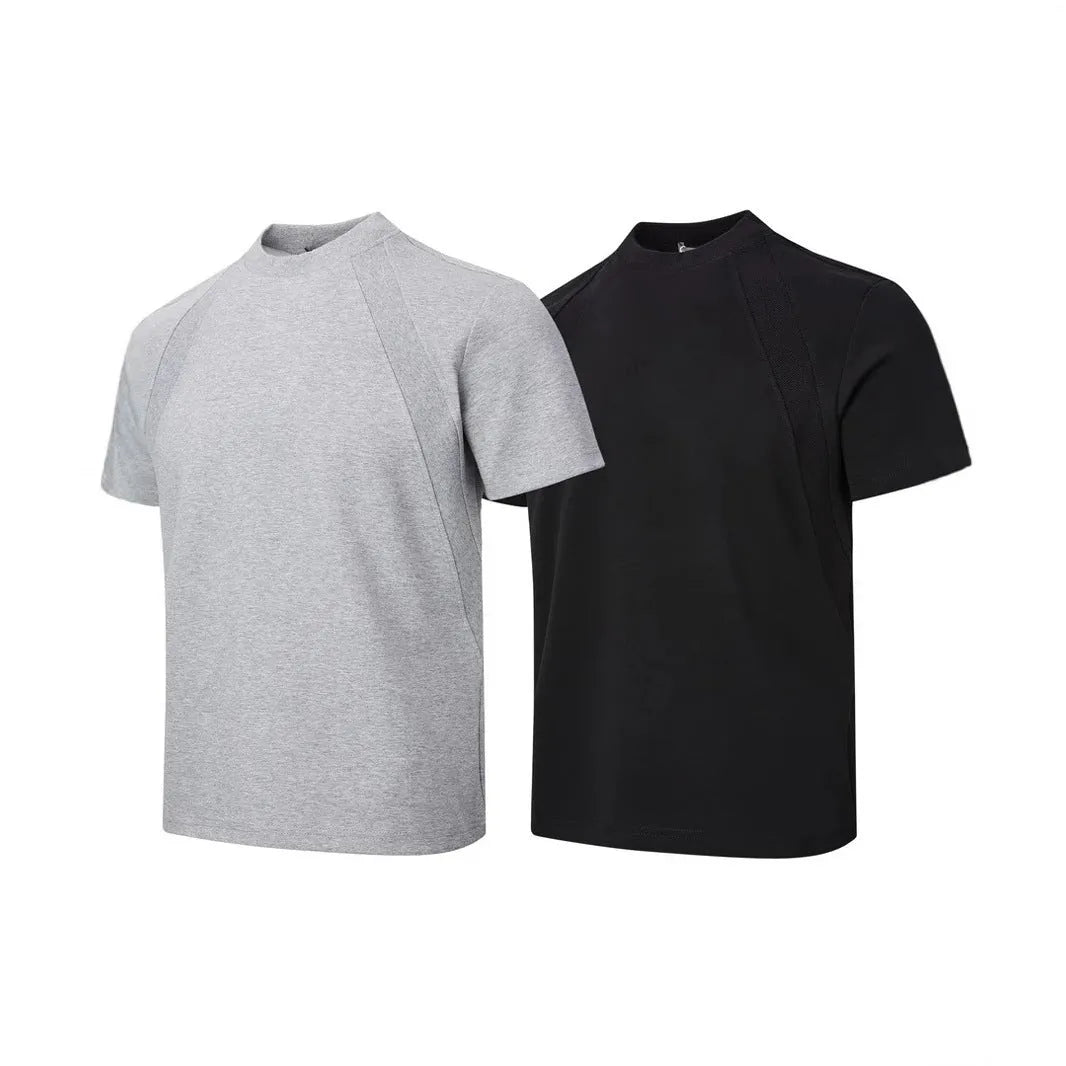Men's black loose-fit short sleeve top with textured air layer stitching detail.