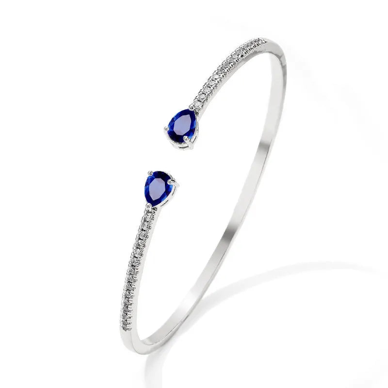 Copper bracelet with multi-zircon inlay in blue or white colour options
