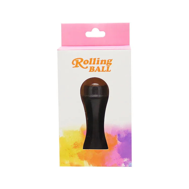 Volcanic stone facial roller for oily skin in black, green, pink, or white on a plain background