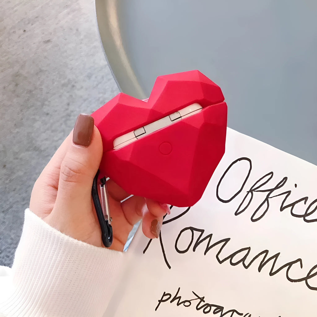 Red diamond love silicone case on Apple AirPods charging case with carabiner clip attached