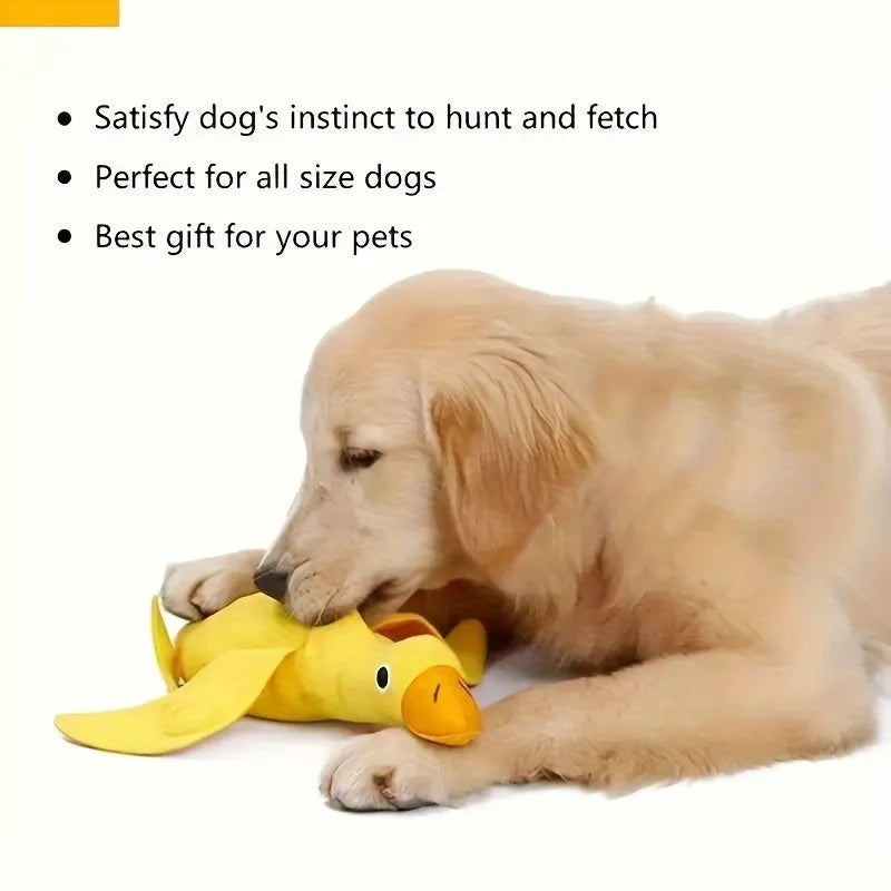 Yellow plush teddy duck dog toy with sound mechanism and treat leak hole for pet training
