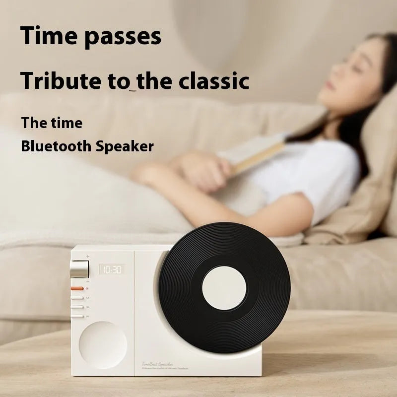 Mini portable Bluetooth speaker in coral pink colour with USB port and memory card slot.