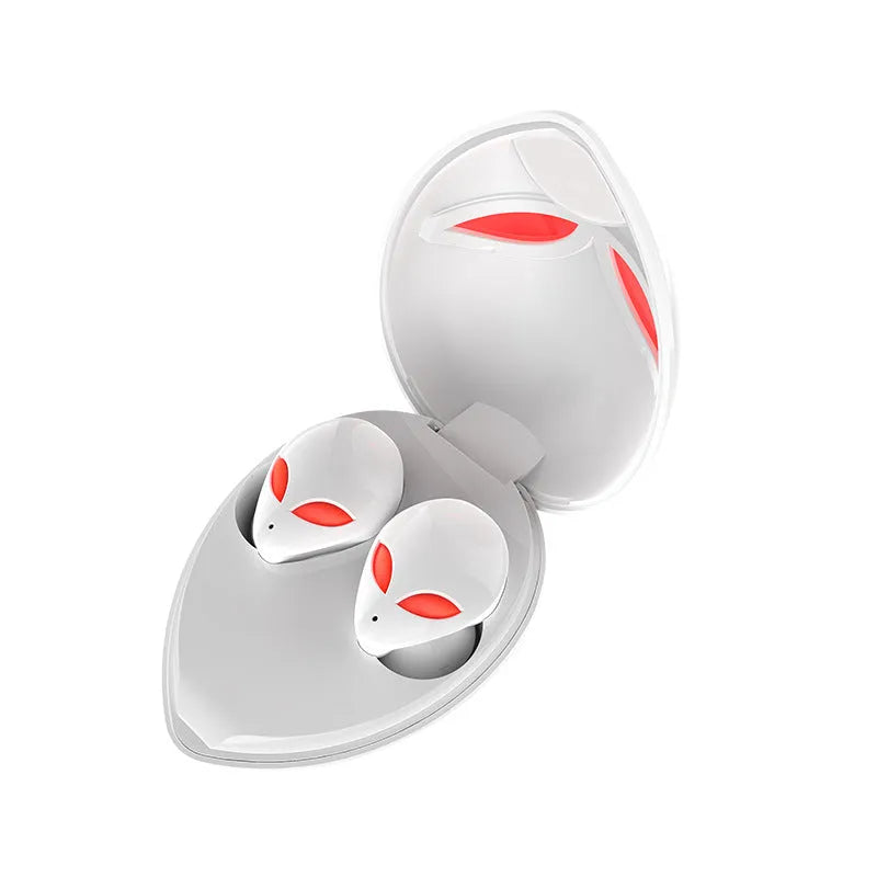 Creative Outer T8 Starman black and white alien design wireless earbuds with LED lights next to charging case.