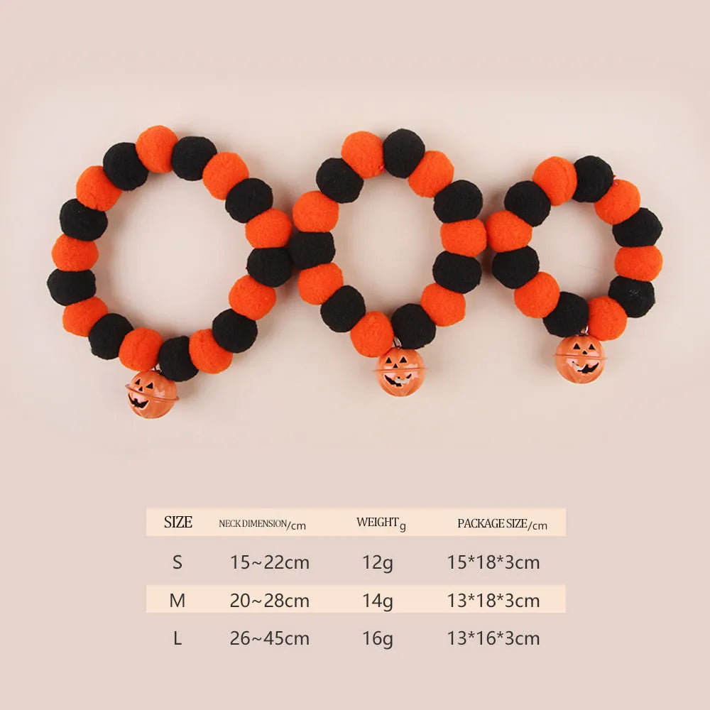 Orange Halloween pet collar for cats with pumpkin pattern and Trick or Treat text, showing plastic buckle.