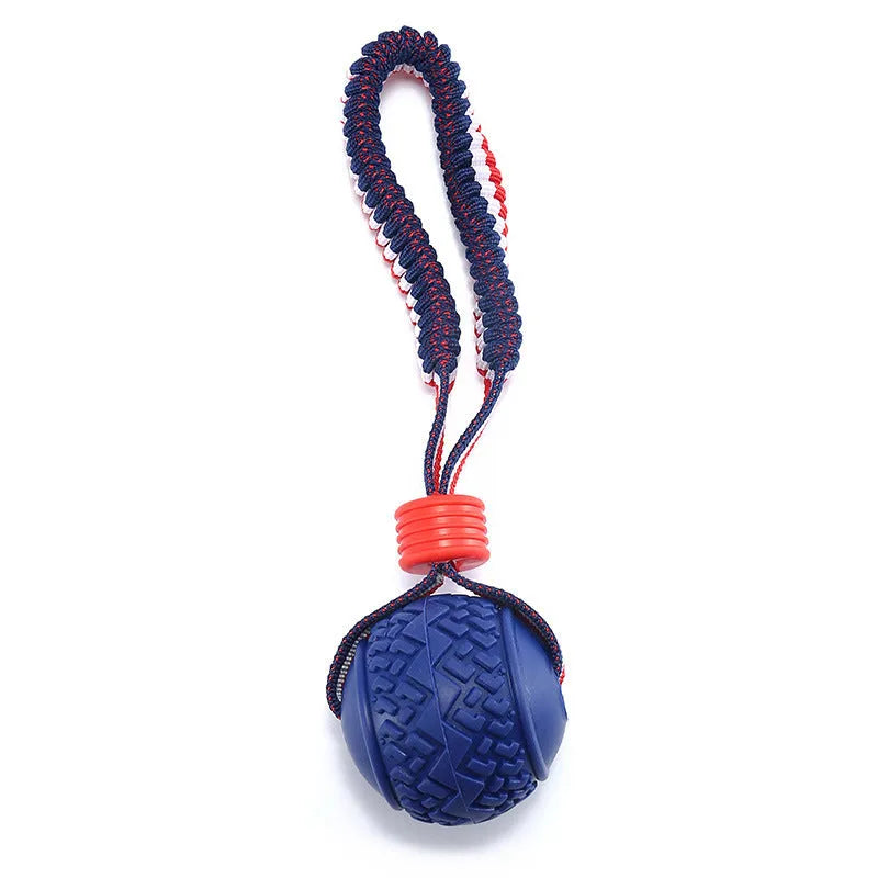 Blue and red durable rubber dog ball attached to a rope for tug-of-war and dental care.