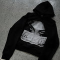 Women's loose fit black polyester hoodie with dark printed cartoon pattern front view