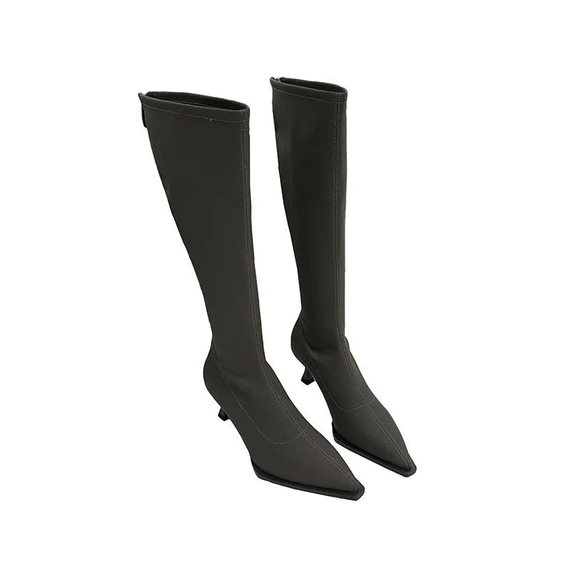 Black women's below-the-knee pointed toe stiletto boots with a back zipper on a white background