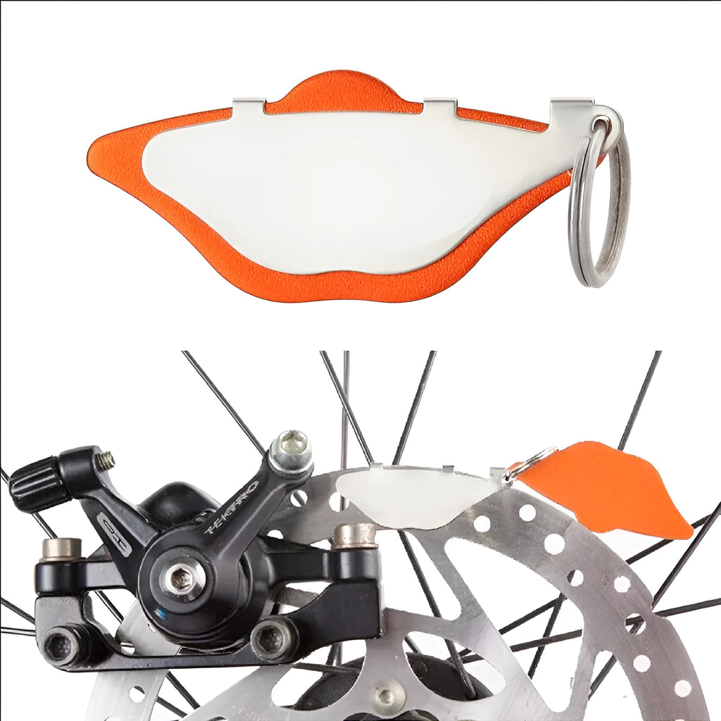 Black and orange mountain bike brake disc pads with metal construction for disc brake systems