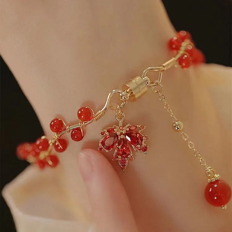 Maple Leaf Girl red ginkgo leaf magnetic bracelet on wrist, electroplated alloy finish