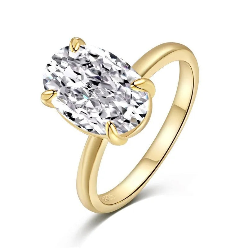Oval solitaire ring in sterling silver with a four-prong setting and a central gemstone.