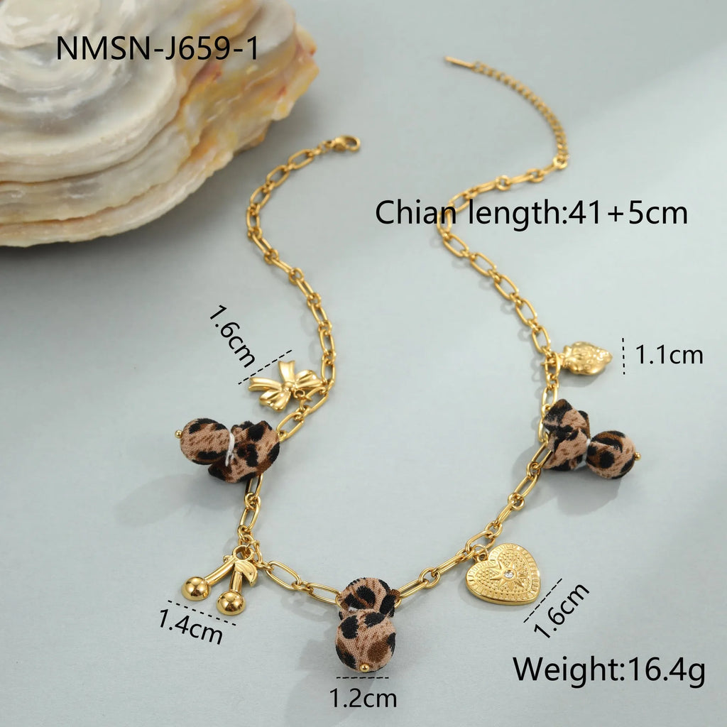 Geometric stainless steel necklace with leopard, heart and flower motifs on 18K electroplated pendant