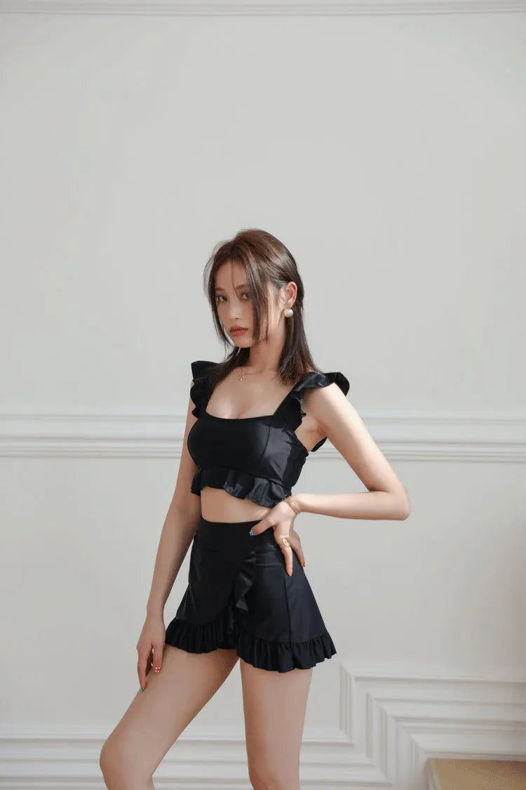 Women's black nylon split swimsuit brief style for swimming and wading flat lay