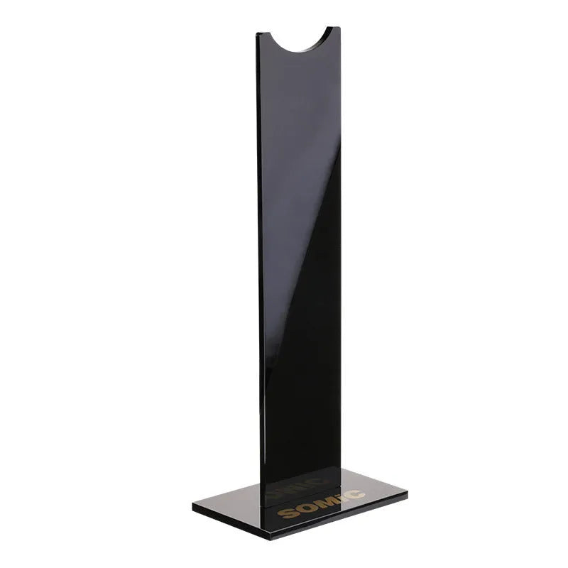 Pink and black detachable headset stand bracket for gaming headphones on a desk