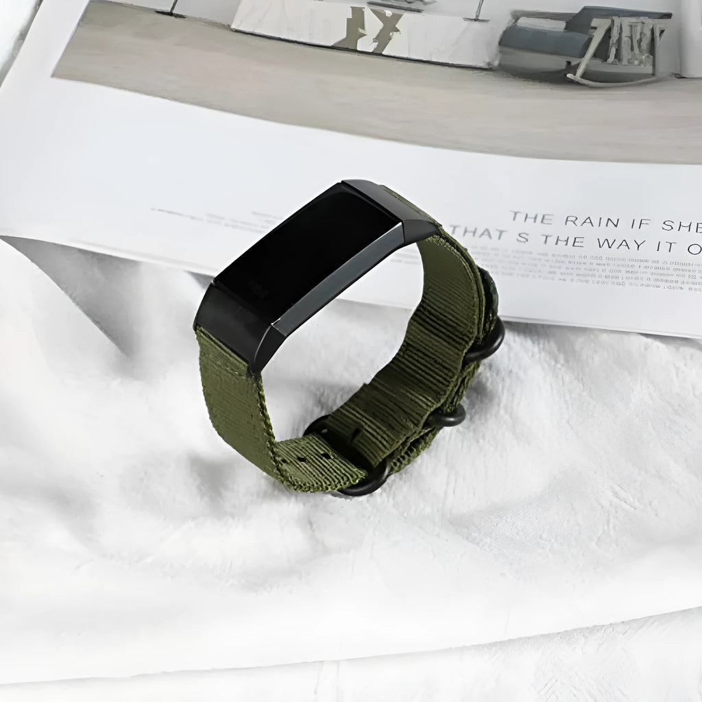 Fitbit Charge nylon replacement strap with a three-ring metal buckle shown in multiple colour options.