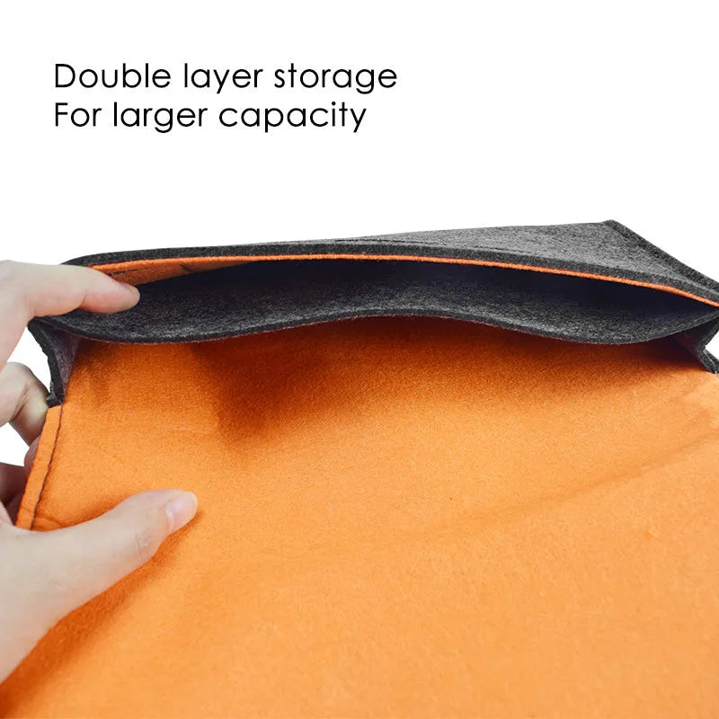 Black Nintendo Switch felt carrying pouch showing game card slots and dual compartments.