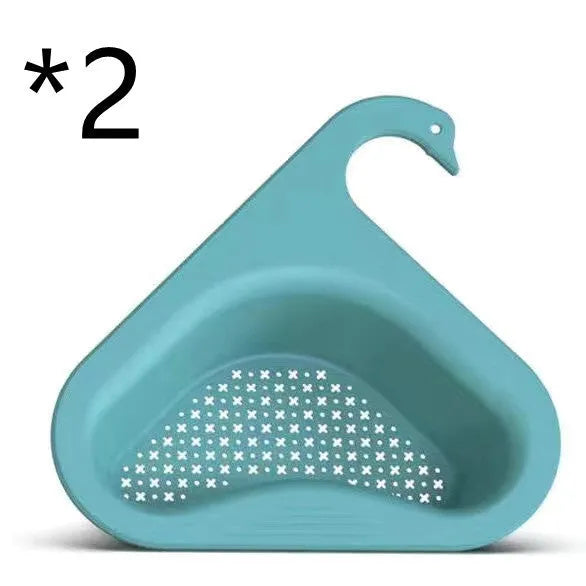Household sink hanging fruit and vegetable drain basket in green plastic, clipped onto sink rim with slotted base