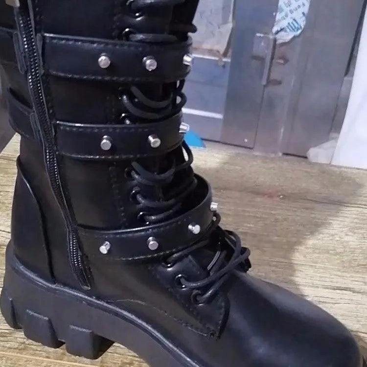 Women's black mid-calf boots with metal buckle strap and side zip on a white background.