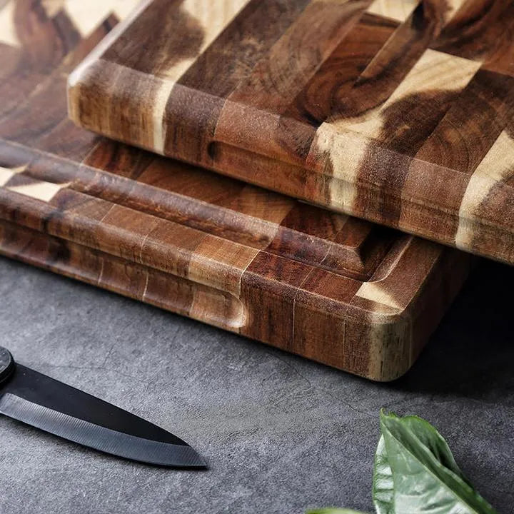 Brown parquet solid wood cutting board made from imported acacia, 3cm thick, on kitchen counter
