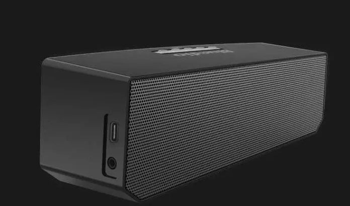 Black rectangular Bluetooth speaker with grille front showing 52mm drivers