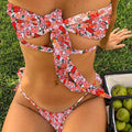 Women's lace-up front swimsuit with padded wireless support in a floral print.