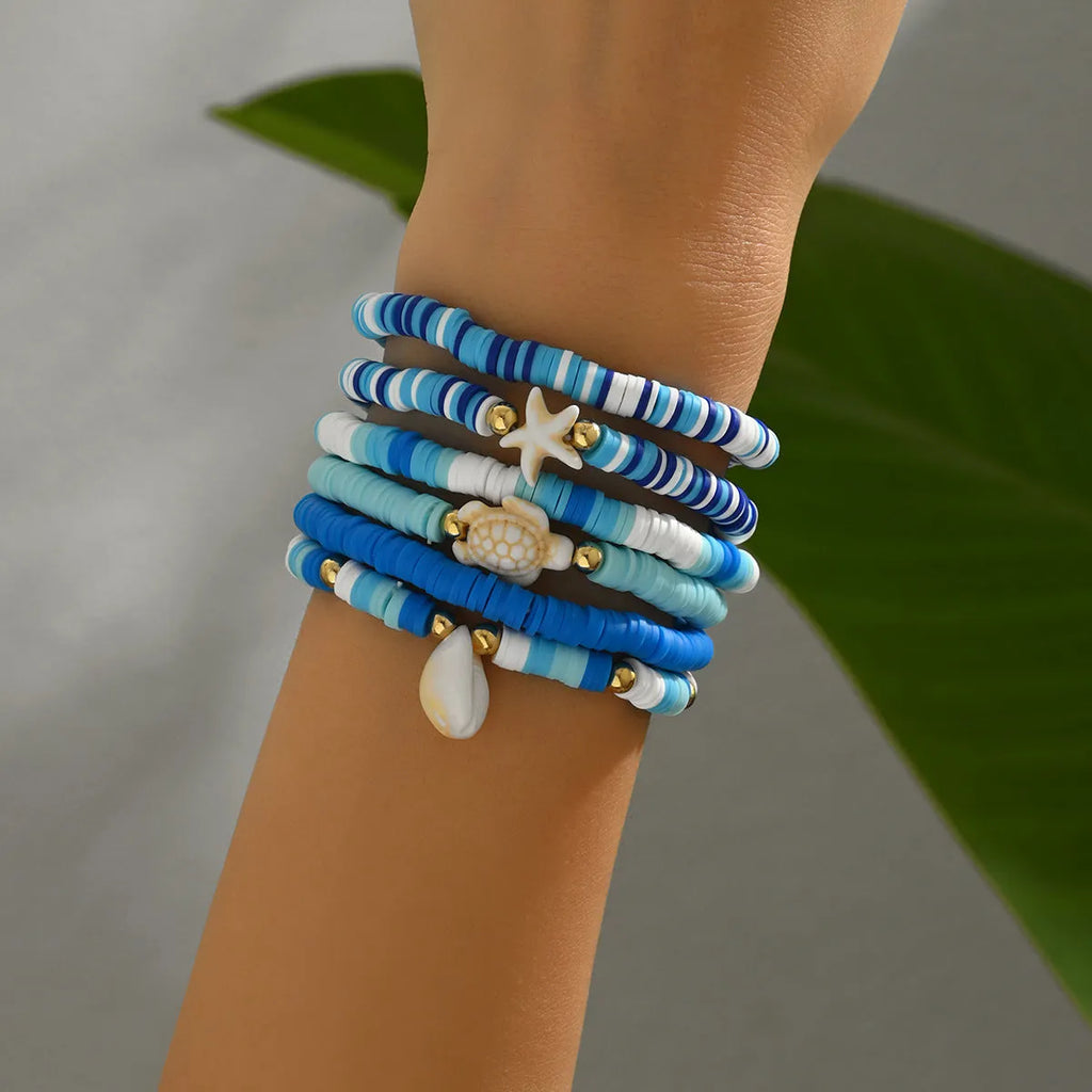 Bohemian blue polymer clay handmade shell bracelet suit set of 6 unisex bracelets on display
