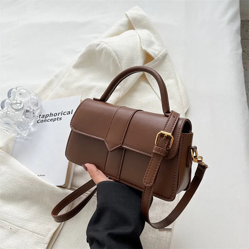 Women's beige PU messenger bag showing internal file organisation and sandwich pocket exterior