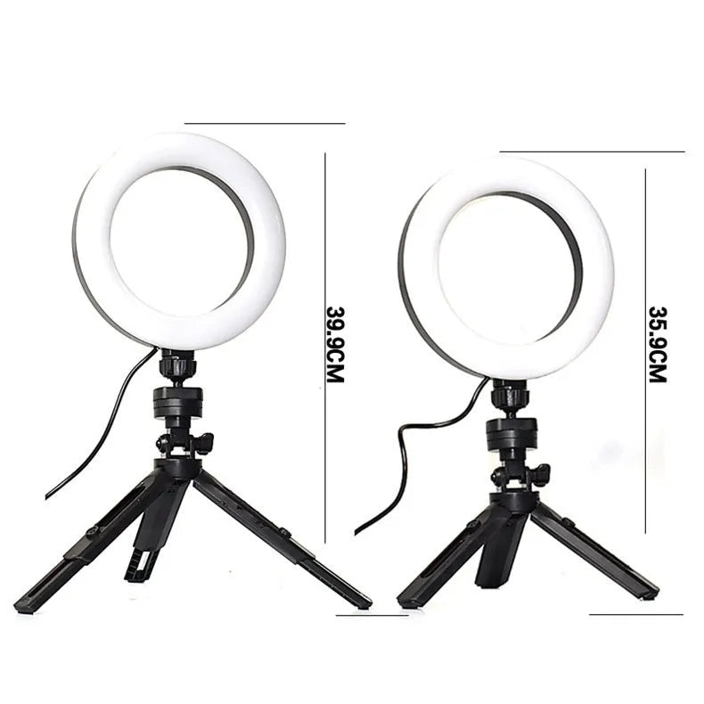 Black desktop fill light tripod suit holding a mobile phone for live streaming video.