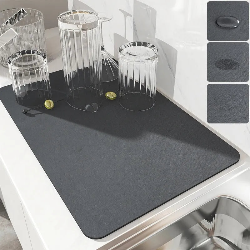 Super absorbent dish drying mat in black PU leather with non-slip rubber backing on a kitchen counter