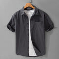 Mens white cotton short sleeve cardigan shirt with loose fit on model