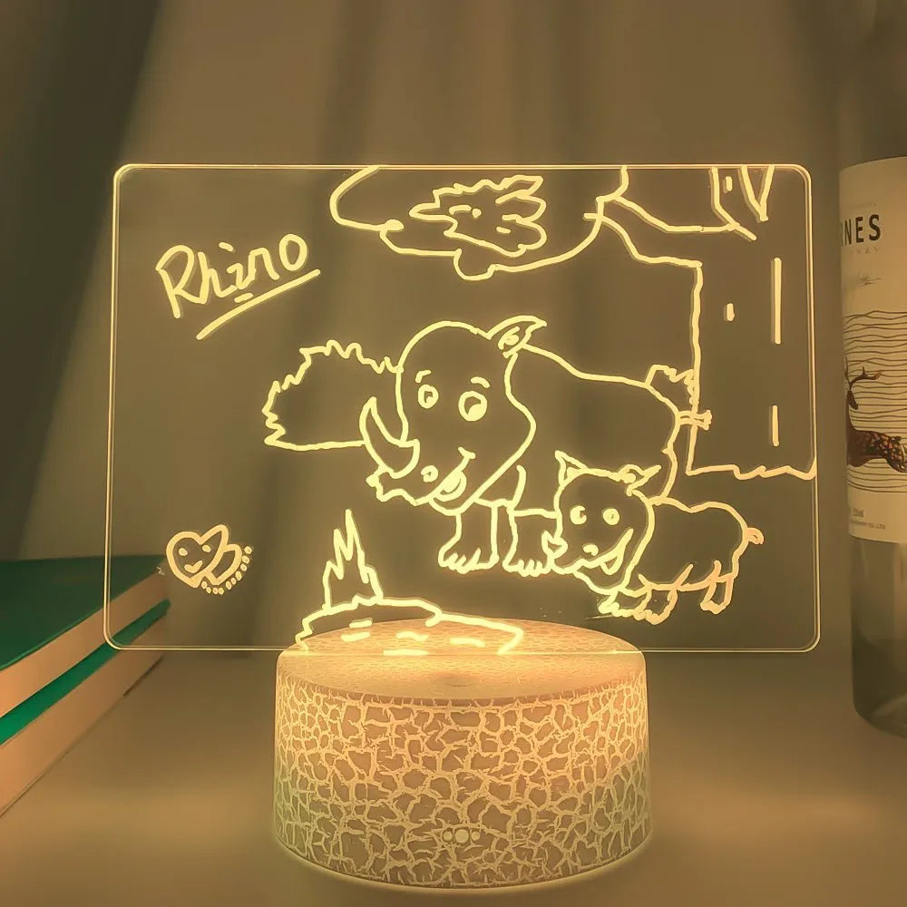 3D acrylic message board with LED lighting and remote control on wooden surface