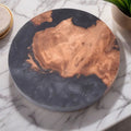 Round and square wooden resin coasters in green and black for heat insulation.