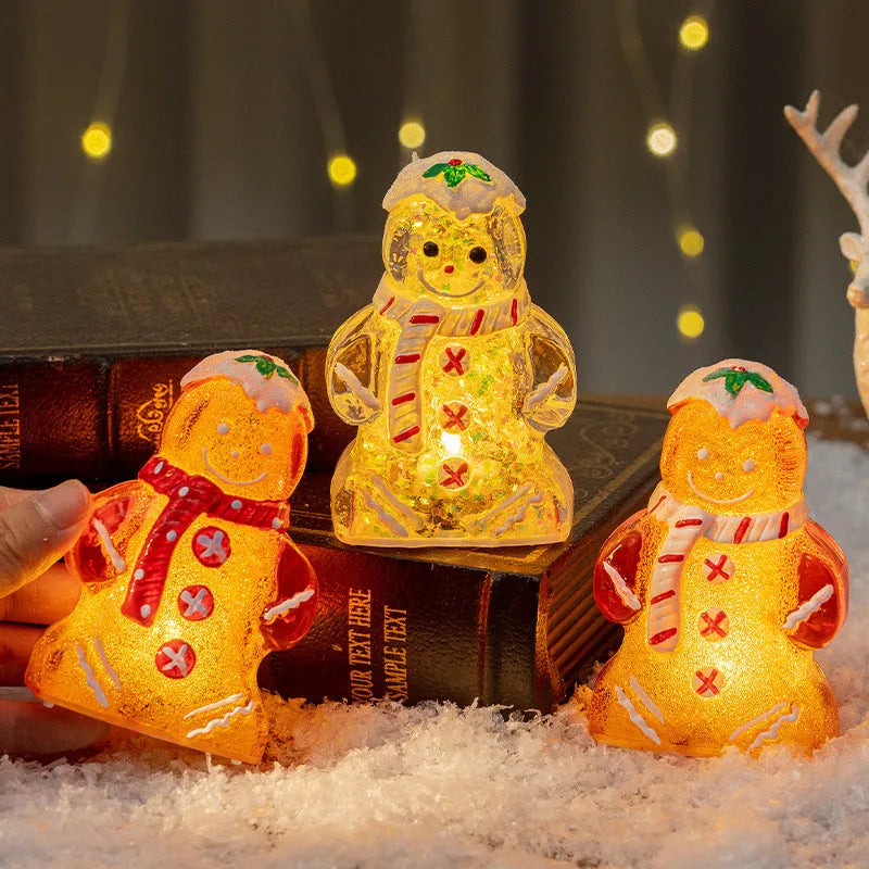 Glowing LED gingerbread man snowman Christmas ornament with a red scarf, measuring 6.5cm by 4cm by 10.5cm.