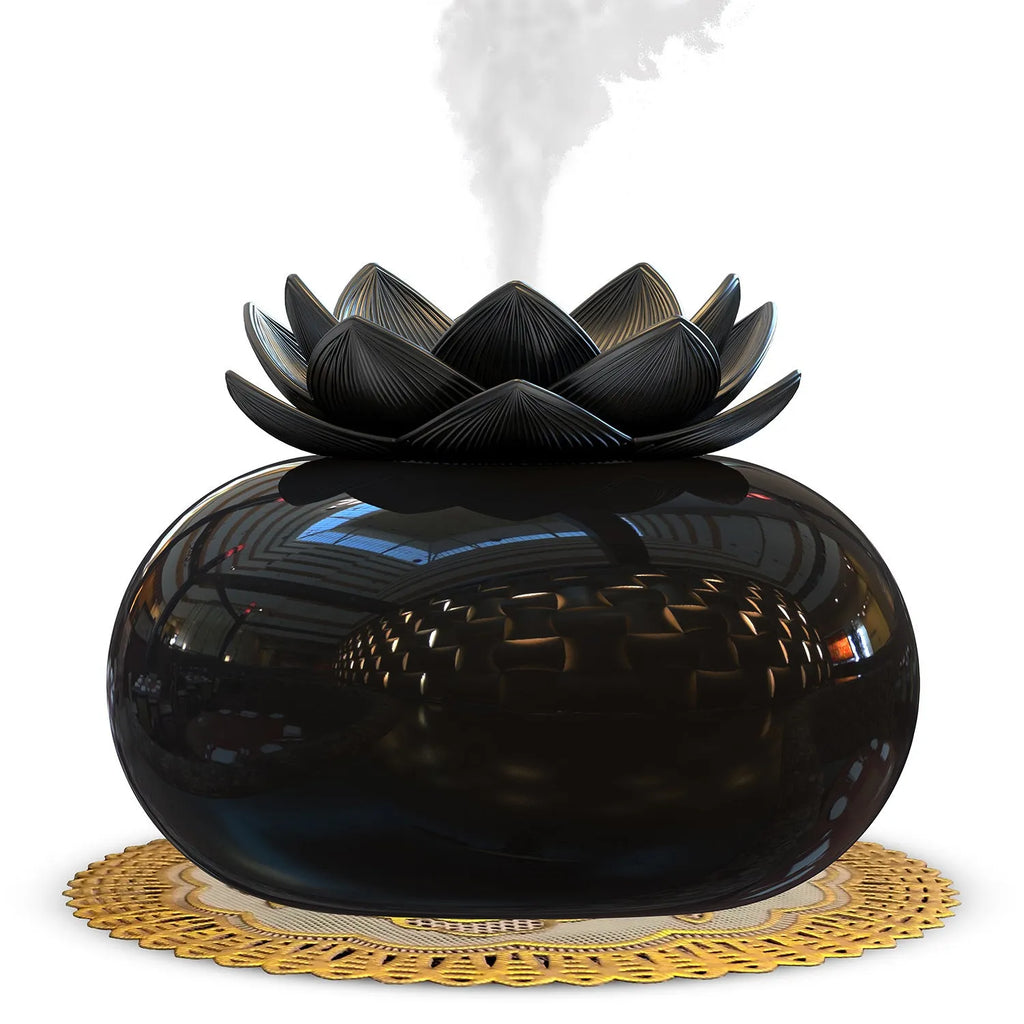 Pure black USB lotus-shaped ultrasonic humidifier and aromatherapy diffuser on a desk.