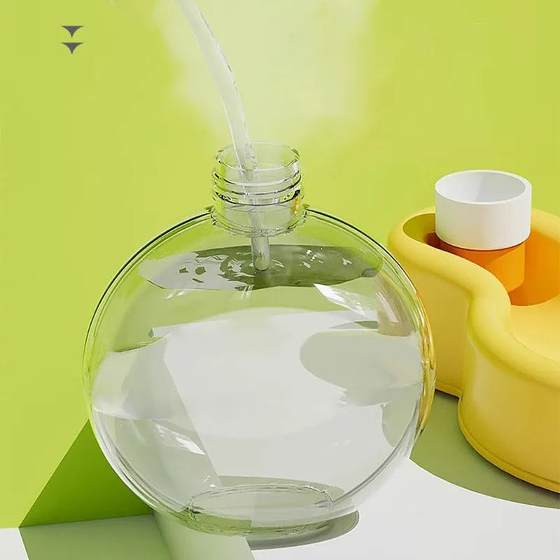 Green portable dog water bottle with pull-out drinking bowl, showing leak-proof design for travel.