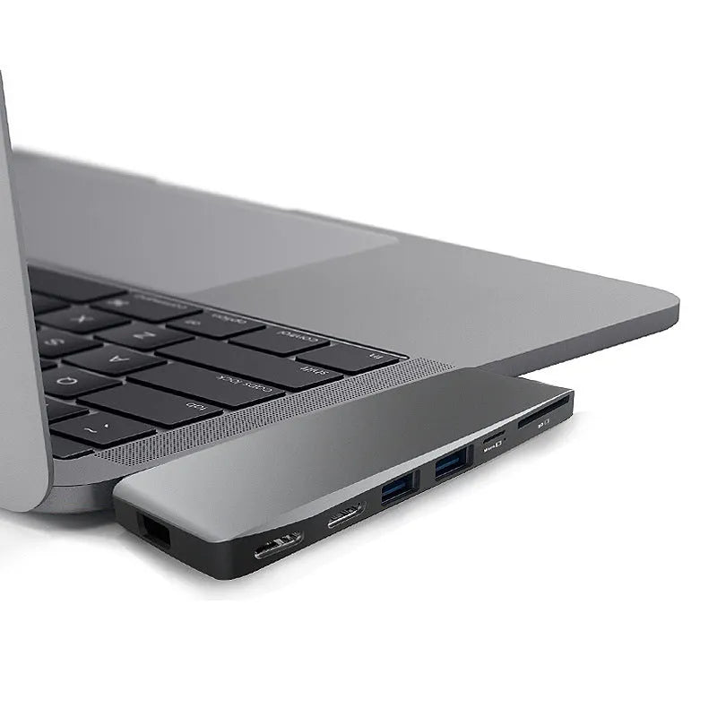 USB-C expansion hub with dual connectors for 2015-2018 MacBook Pro showing eight interface ports