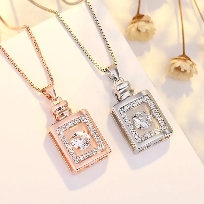 Silver love heart-shaped necklace with crown and bow charms in rose gold or silver finish