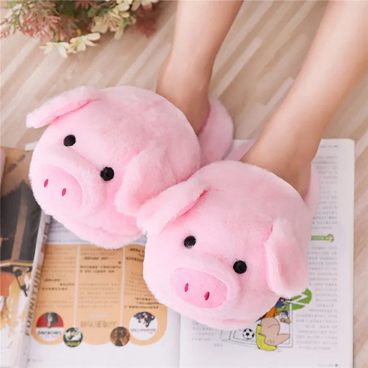 Pink pig floor slippers with soft plush exterior and cushioned interior for indoor wear