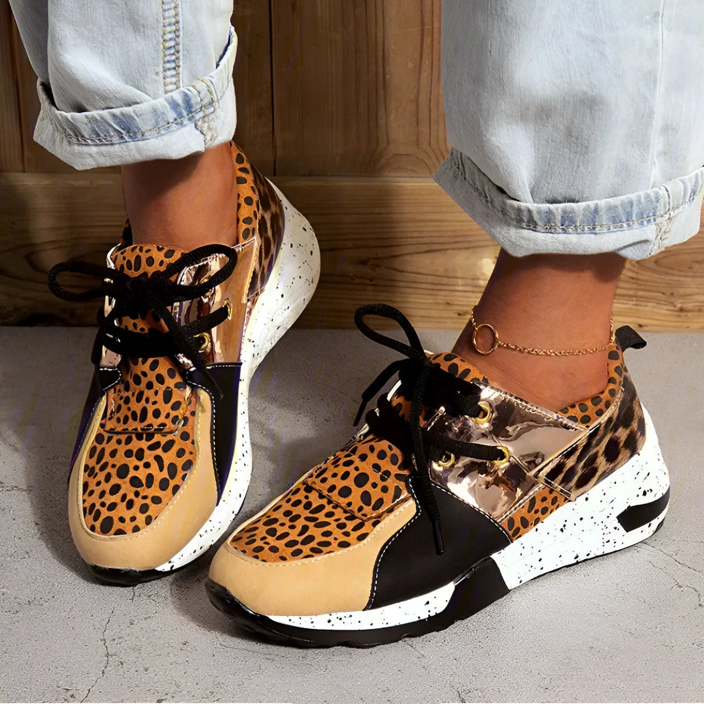 Women's suede casual sneakers with a wedge heel in leopard print colour.