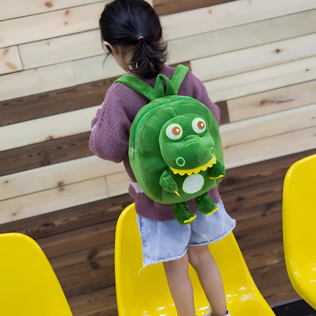 Soft plush baby dinosaur character backpack with embroidery detailing and soft handle