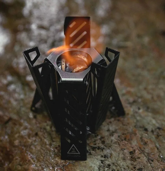 Hexagon foldable alcohol camping stove in black or silver with 9.5x8.5x15cm dimensions