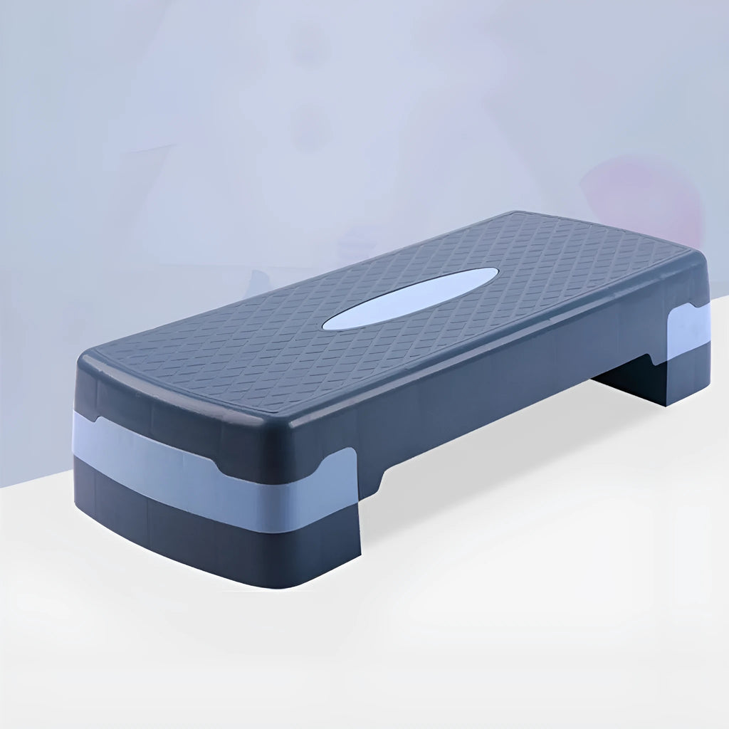 Grey Fit Step aerobic fitness stepper platform on a wooden floor.
